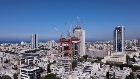 david bloch st con grúas de construcción por encima de los edificios, establecimiento aéreo panorámico