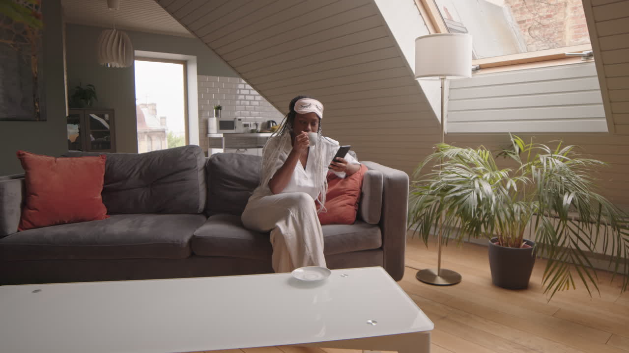 African American Woman Drinking Coffee in Morning