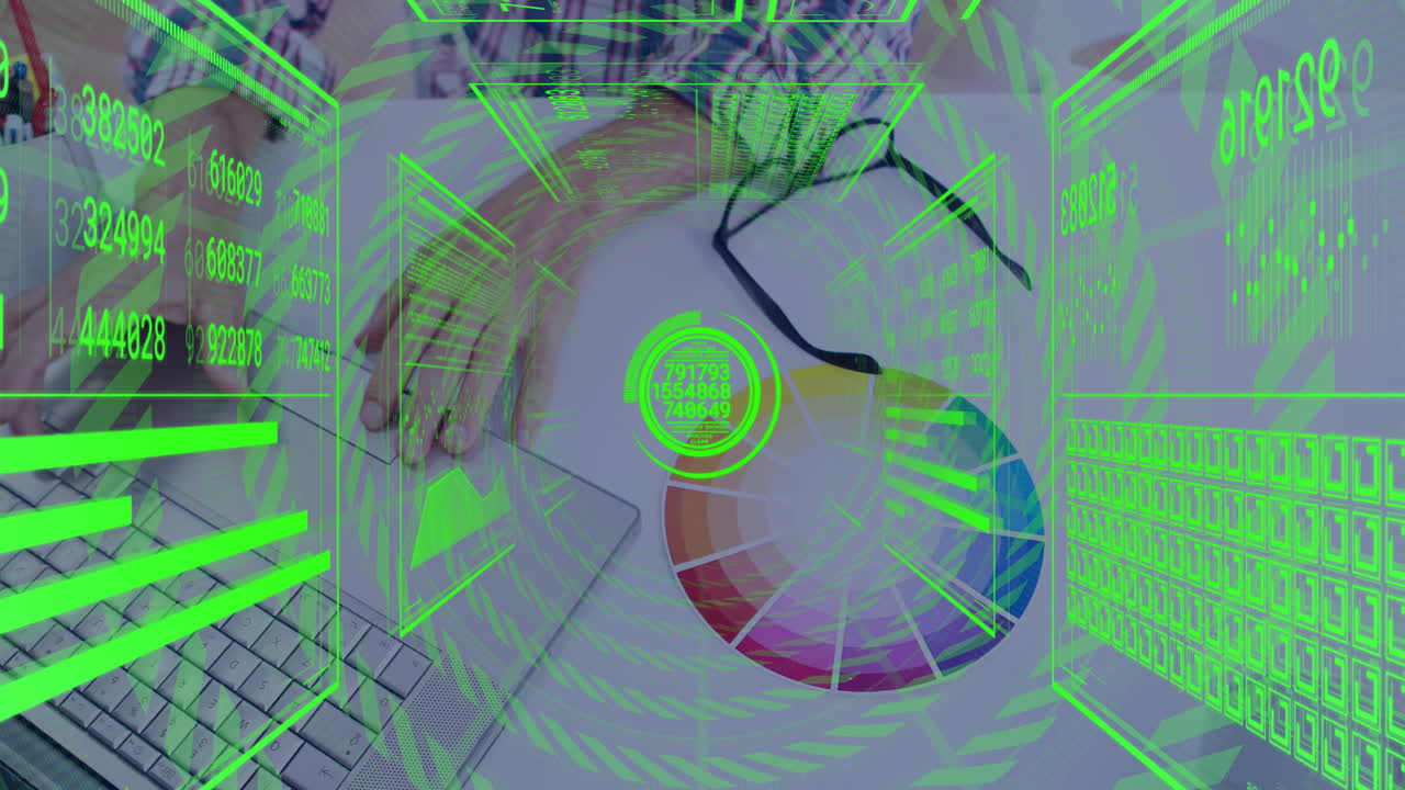 man typing on laptop keyboard in tech workspace, overlaying neon green data graphs with color wheel