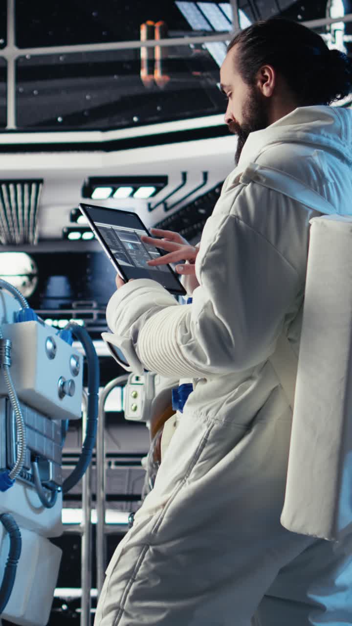 Vertical video Portrait of astronaut wearing helmet before stepping out of space station