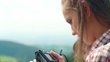 Side-view-of--woman-taking-a-photo