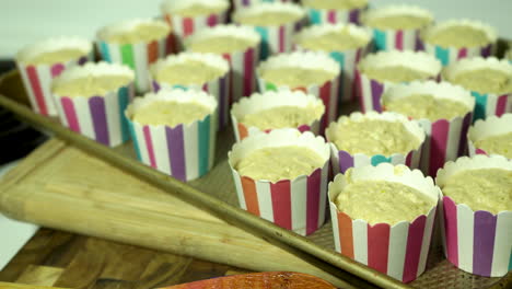 a tray full of cupcakes ready to be baked in the oven