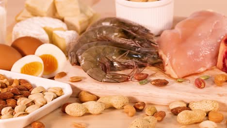 variety of protein-rich foods on wooden board