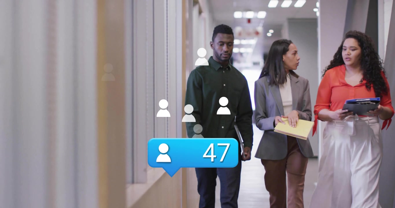 Animation of media icons over diverse colleagues discussing work and walking in office