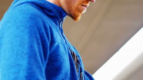 young man checking his smartwatch on the street, 4k 4k