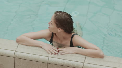 Woman Swimming in Pool