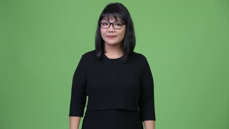 beautiful asian businesswoman giving thumbs up