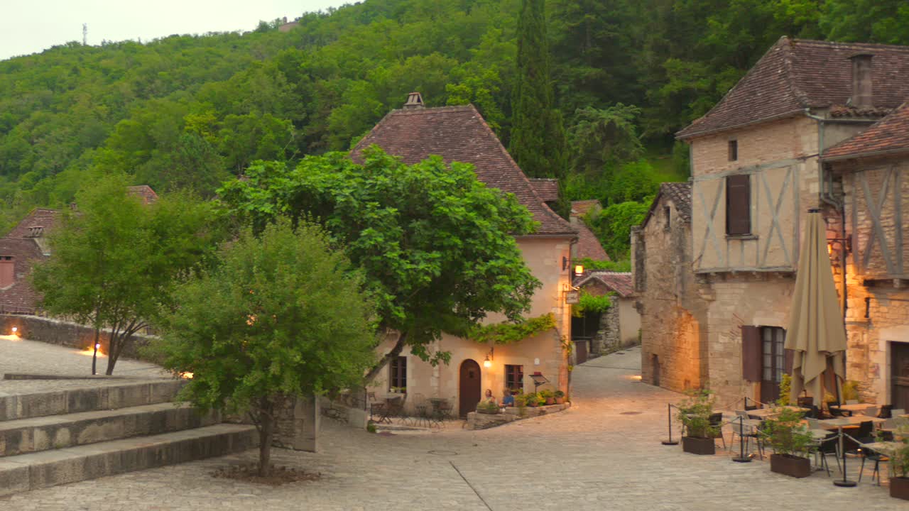 Street view of Saint Cirq Lapopie, one of France's most beautiful villages, with stone houses and medieval charm