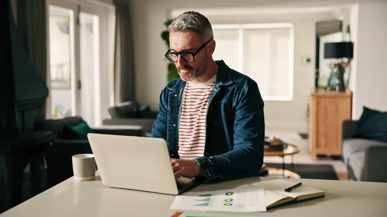 Man Working from Home on Laptop