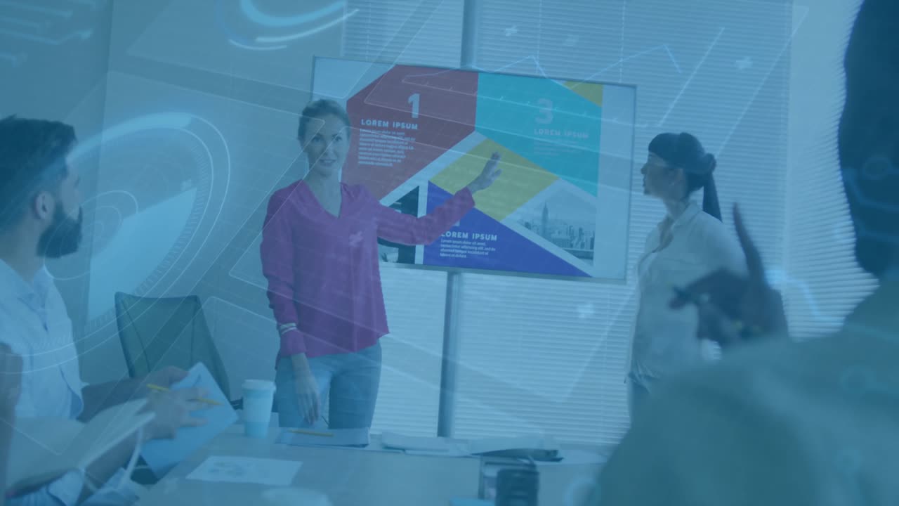 Business presenter pointing display after peer tapping tablet animating graphics emphasizing points