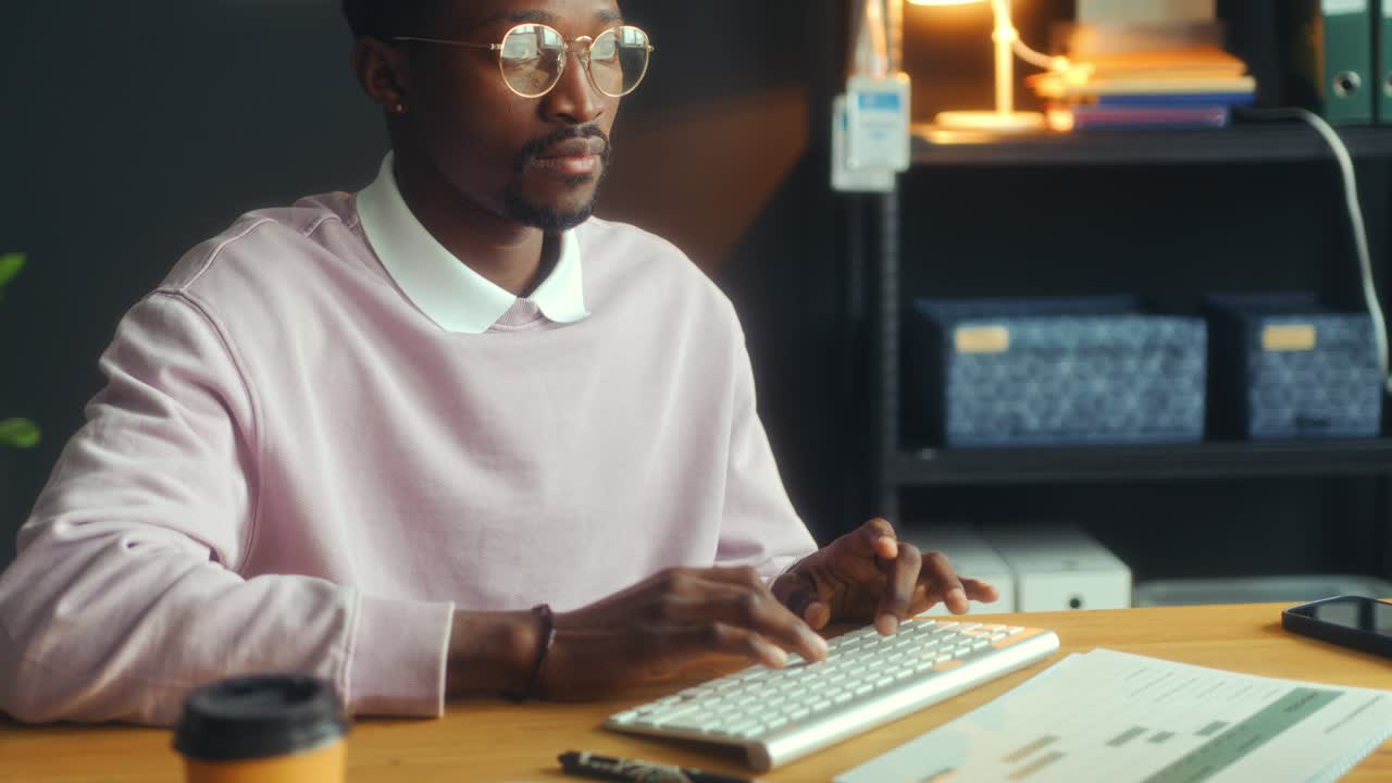 Young African American Businessman Using Computer at Desk