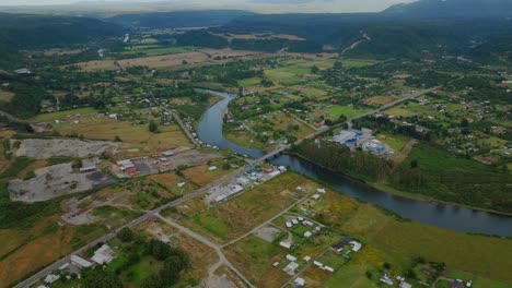 Aerial-View-Over-Winding-Chamiza-River-With-Local-Town-And-Villages