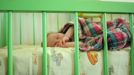 newborn baby boy in bed