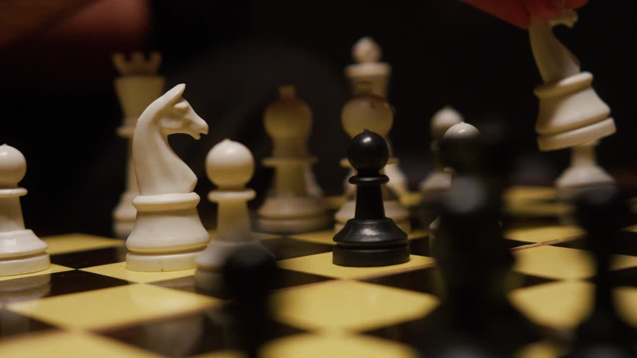 Close-up of a chess game, intense focus, strategic thinking