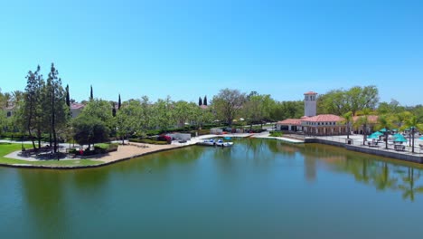 Aerial-fly-over-and-to-a-community-lake-boat-dock