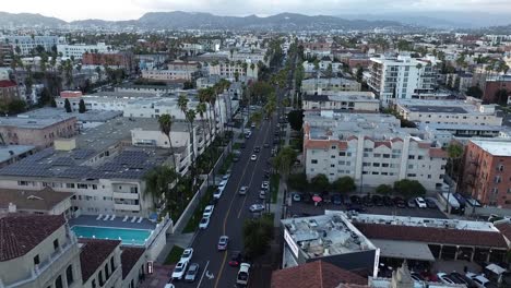 Push-in-drone-shot-of-dense-city-neighborhood-in-Los-Angeles