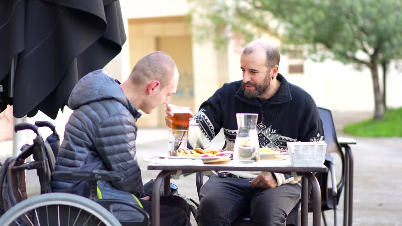 Friends Enjoying a Meal at an Outdoor Cafe