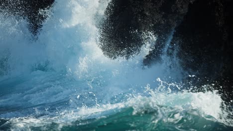 powerful waves crashing against rocky coast