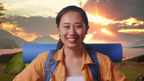 happy woman on a camping trip at sunset