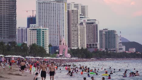 crowd of people at nha trang beach, vietnam