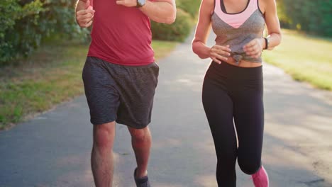 Couple-jogging-during-sunny-afternoon,-Katowice,-Poland