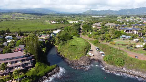 stunning aerial view capturing oceanfront resort hotels, beach, blue ocean and mountain landscape