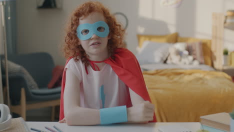 young superhero in bedroom