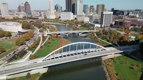 aerial pan up of scioto river view of downtown columbus, ohio