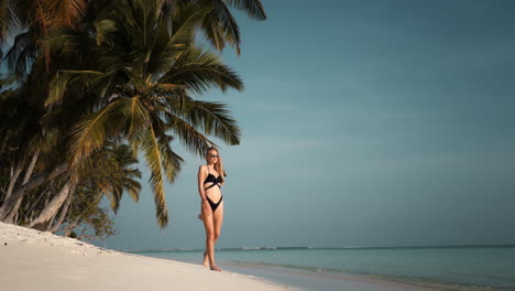woman in bikini on tropical beach