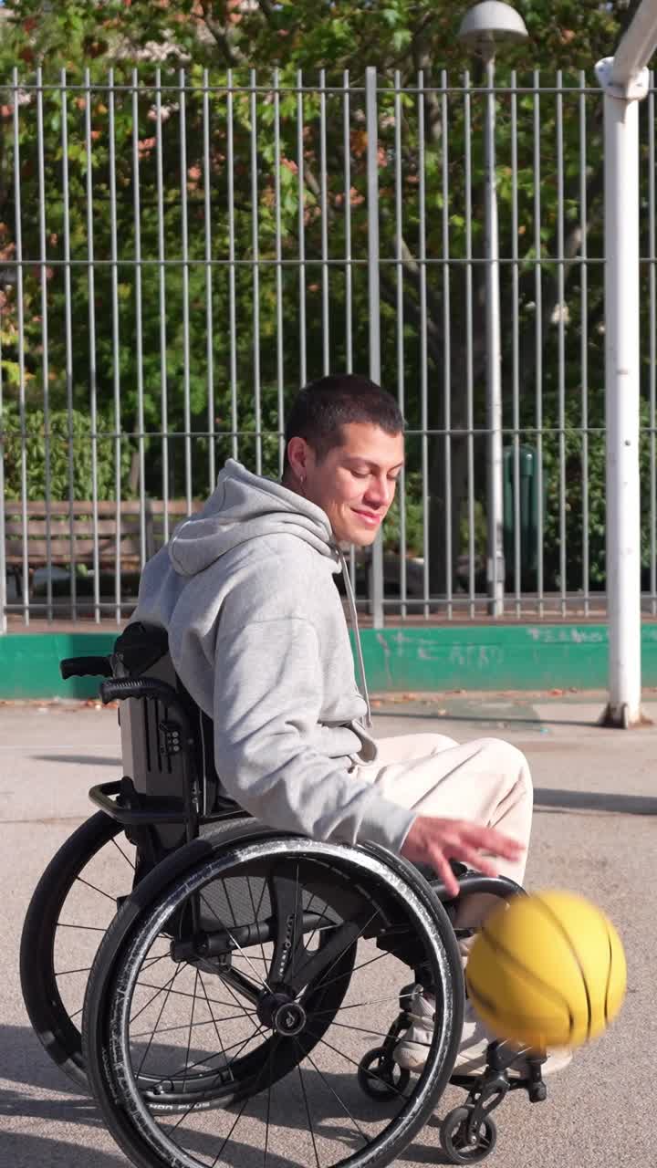 Young Man in Wheelchair Dribbling Basketball on Outdoor Court