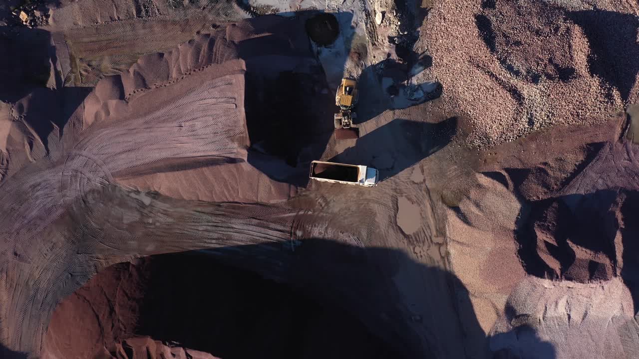 Aerial view of trucks in a sand quarry
