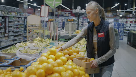 woman working in a grocery store produce section