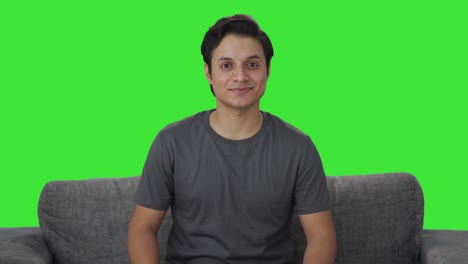 happy indian man smiling to the camera green screen