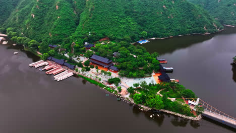 aerial view orbiting the temple at the huanghuacheng great wall, summer in china