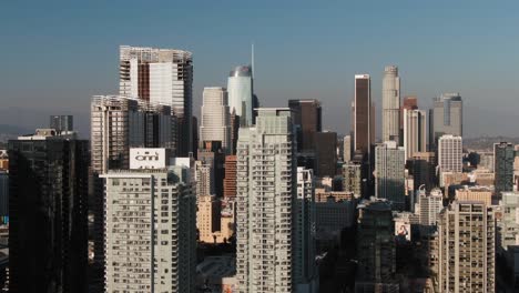 los angeles downtown, modern skyscraper buildings in financial district, aerial orbiting shot