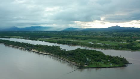 The-beautiful-green-shoreline-of-the-Beach-in-the-Fiji-Islands-on-cloudy-day---aerial