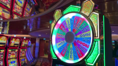 Casino-Wheel-of-Fortune-slot-machine-with-colorful-flashing-lights,-4K