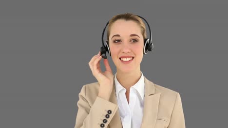 smiling call centre agent talking on the headset