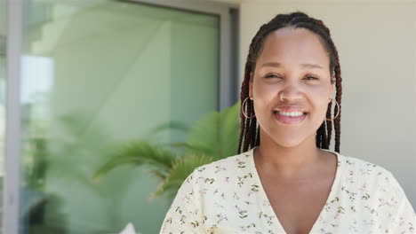 young biracial woman smiles brightly, with copy space