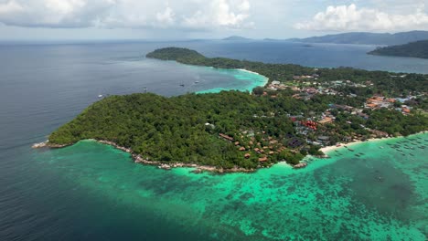 Tropical-thailand-small-island-of-Koh-Lipe-,-Aerial-pull-back-to-reveal-turquoise-blue-water-and-coral-reefs-on-sunny-day