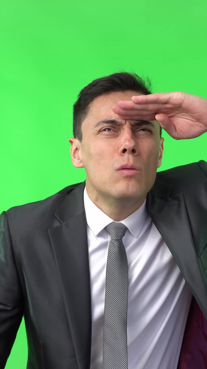 Businessman Looking into the Distance on Green Screen