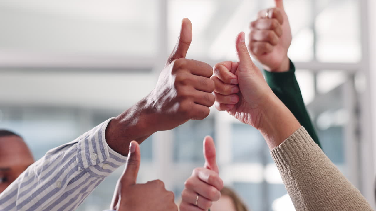 Group giving thumbs up in agreement