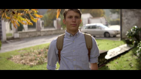 Teenage Boy Walking in Autumnal Village