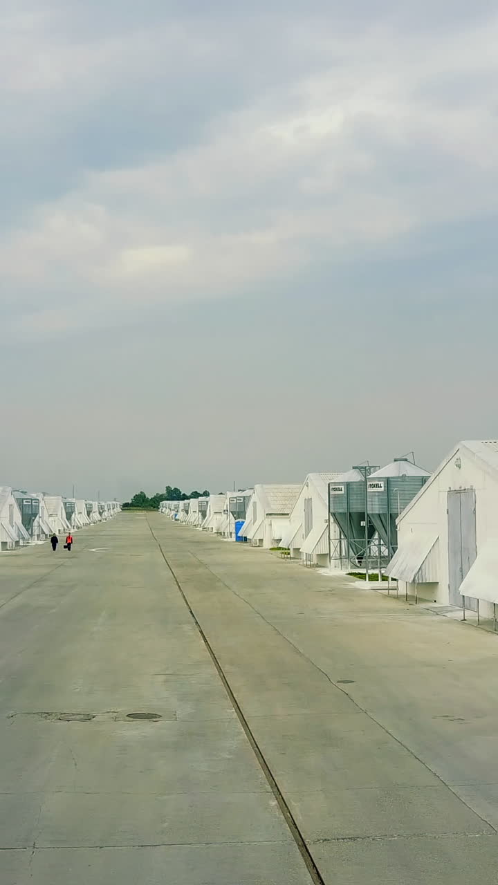 View Of Poultry Houses. Aerial view of poultry farm in the countryside Vertical video