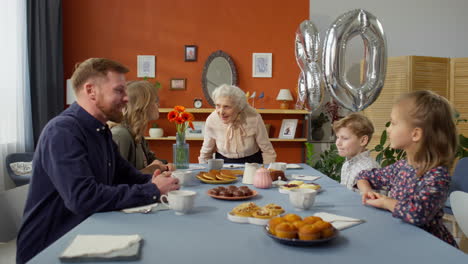 grandmother having birthday dinner with family