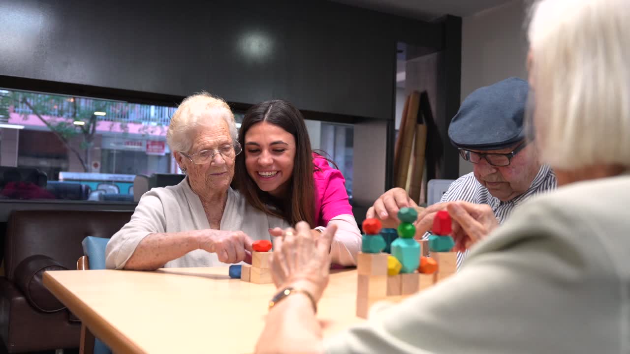Elderly people playing with wooden blocks