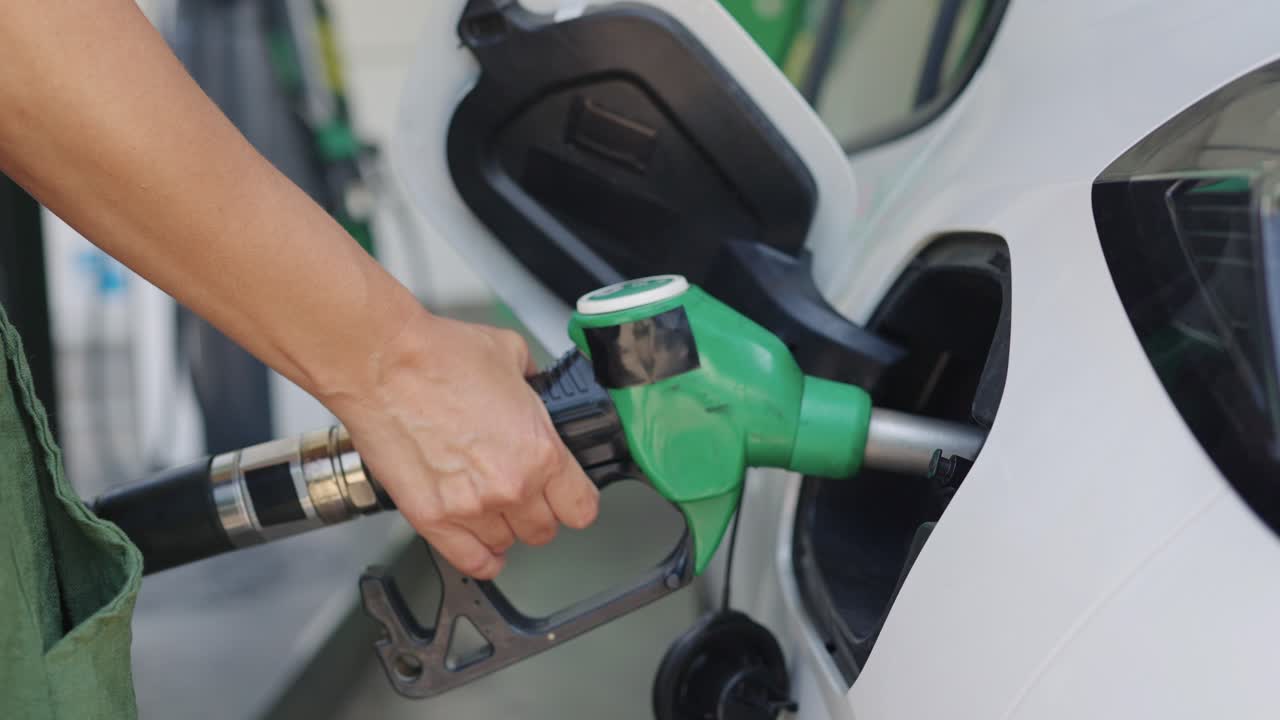 Refueling car at gas station