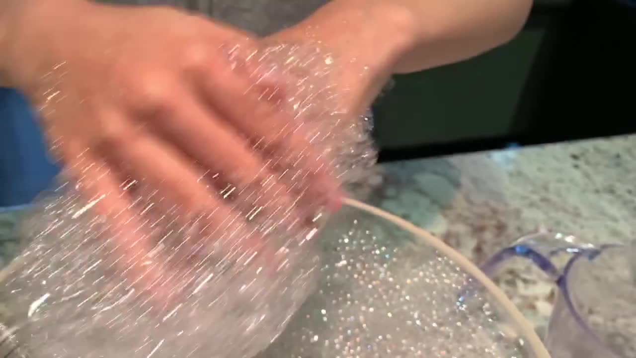 Child playing with soap bubbles and rubbing hands with foam. Sensory play. Killing germs. Fighting bacteria and viruses.