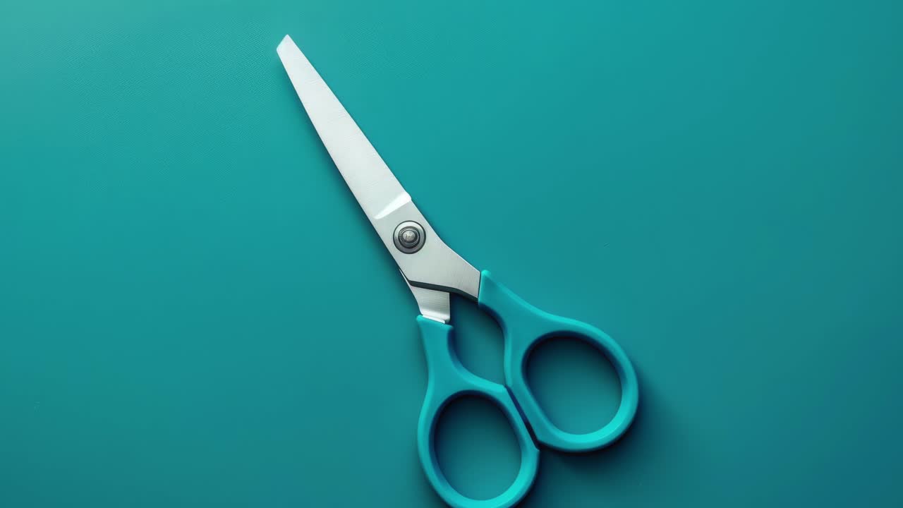 Blue Handled Scissors on Teal Background in Minimalist Style