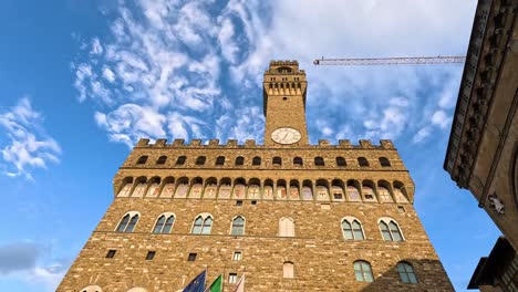 people gather near historic palazzo vecchio building